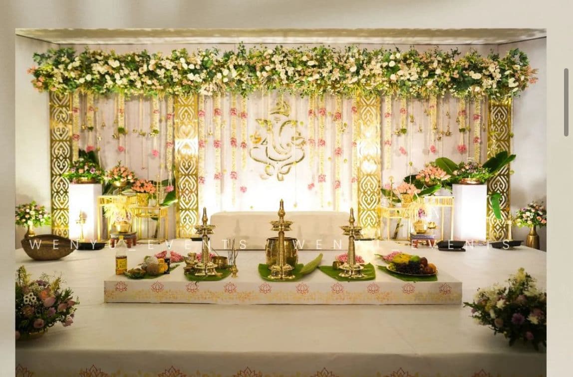 Floral wedding stage decoration with traditional lamps